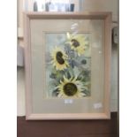 A framed and glazed watercolour of sunflowers