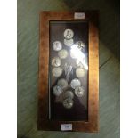 A cased set of mounted coinage
