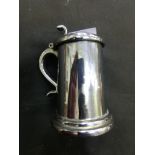 A plated mid-20th century cigarette table lighter in the form of tankard