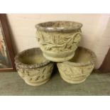 Three weathered garden stoneware pots with floral design