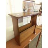 A reproduction mahogany occasional table with magazine rack to base