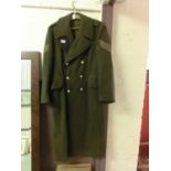 A green military long coat