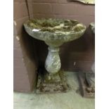 A composite stone bird bath