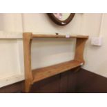 A waxed pine shelving unit