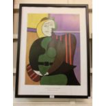 A reproduction framed advertising Picasso print