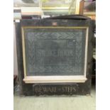 A wooden framed pub window 'Smoke Room' with plaque below 'Beware of Steps'