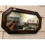 A mid-20th century oak framed bevel glass mirror