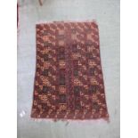 A hand woven Turkish brown ground rug