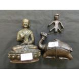 A cast possible bronze sitting Buddha together with a cast metal figure of camel