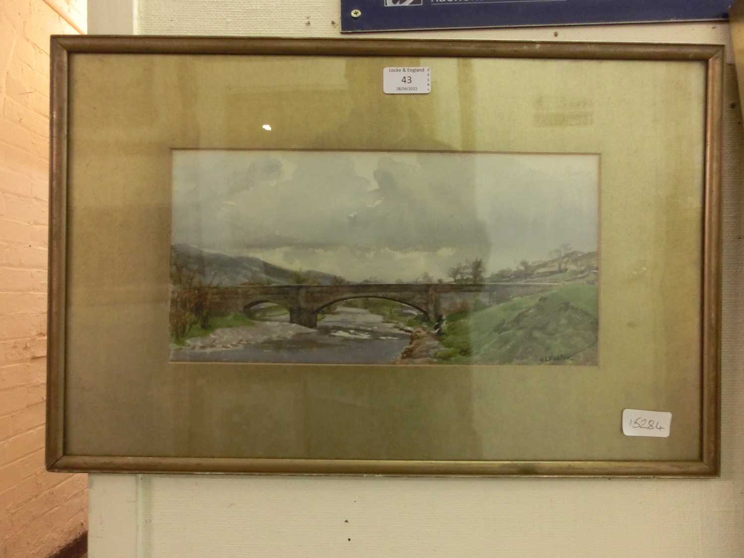 A framed and glazed watercolour of bridge scene signed H.L.Foster