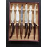 A mid-20th century steak knife set