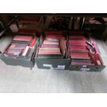 Three trays of hardback books