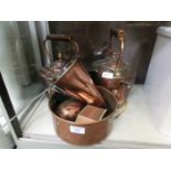 A quantity of copperware to include two kettles, funnel, pans, etc