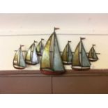 A metal wall hanging artwork of sailing vessels