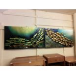 A pair of metal wall hanging artworks of fishes