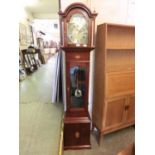 A reproduction mahogany cased granddaughter clock