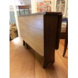 A mid-20th century teak drop leaf occasional table