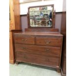 An early 20th century mahogany dressing chest, the bevelled plate over two short and two long