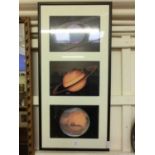 A framed and glazed photographic print of three planets