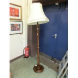 A turned beech standard lamp