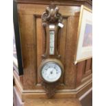 An early 20th century carved oak banjo barometer
