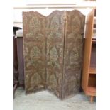 A late 19th century embossed leather three fold screen