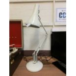 A cream angle poise style lamp