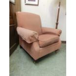 A reproduction Victorian style chair upholstered in a salmon pink fabric