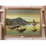 A gilt framed oil on board of sailing vessels