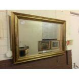 A gilt framed bevel glass rectangular mirror