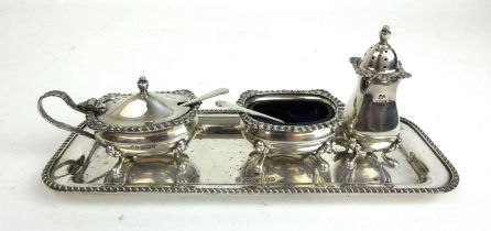 An Elizabeth II silver four piece condiment set. Hallmarked for Birmingham 1974, makers mark for