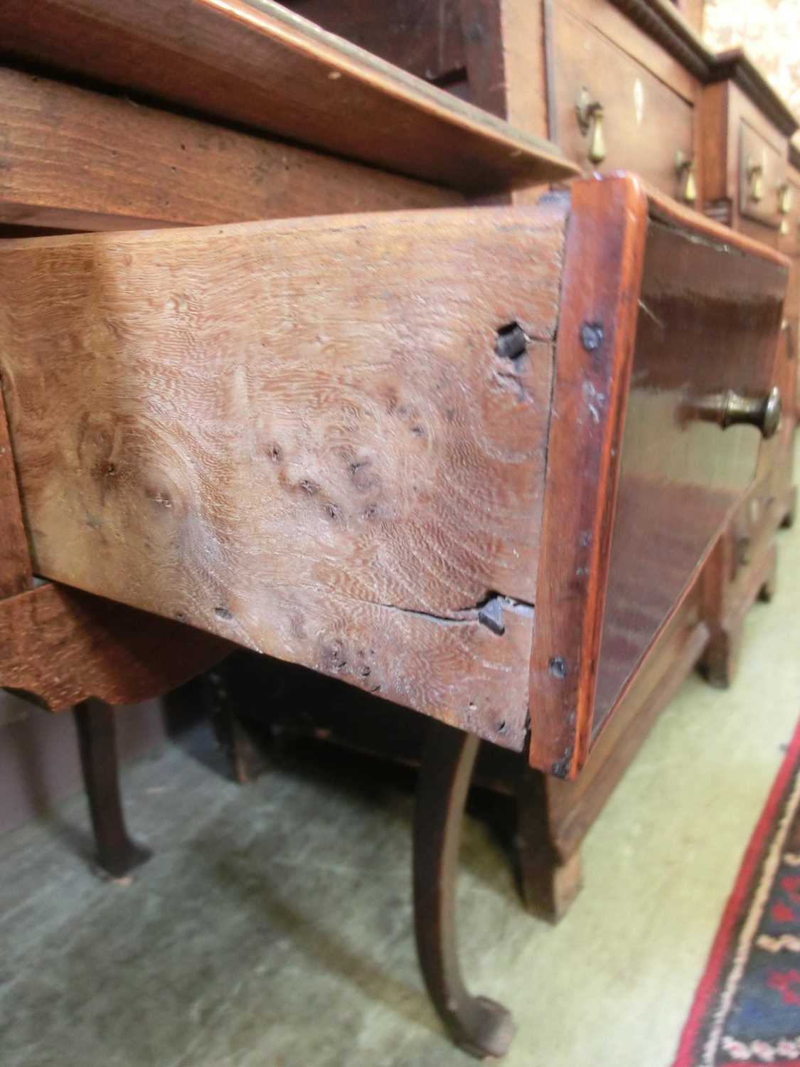 An early 18th century beech and fruitwood side table, the moulded top over two drawers on cabriole - Image 12 of 13