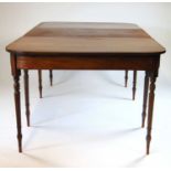 An early 19th century and later mahogany extending dining table, the two D-ends on turned legs