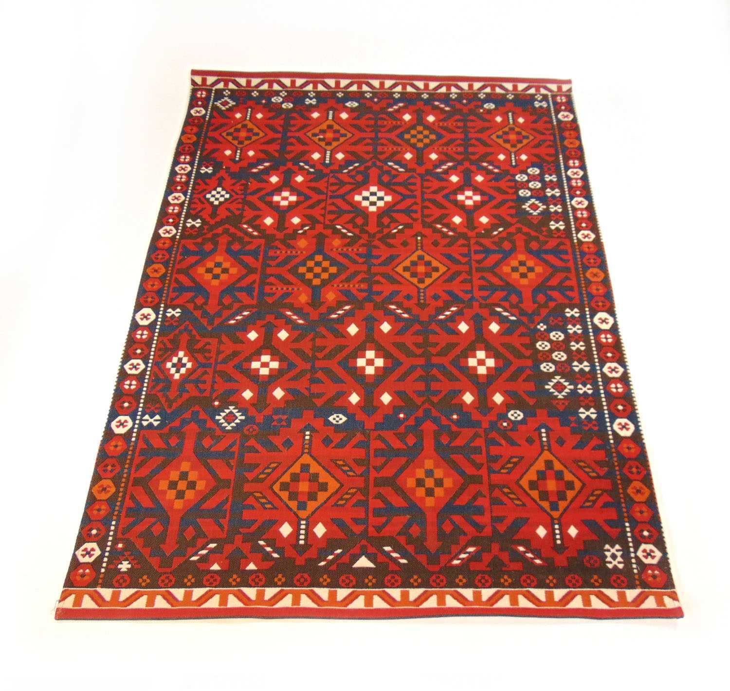 A modern handwoven Turkish rug, the border surrounding the red ground field with geometric design, - Image 2 of 2