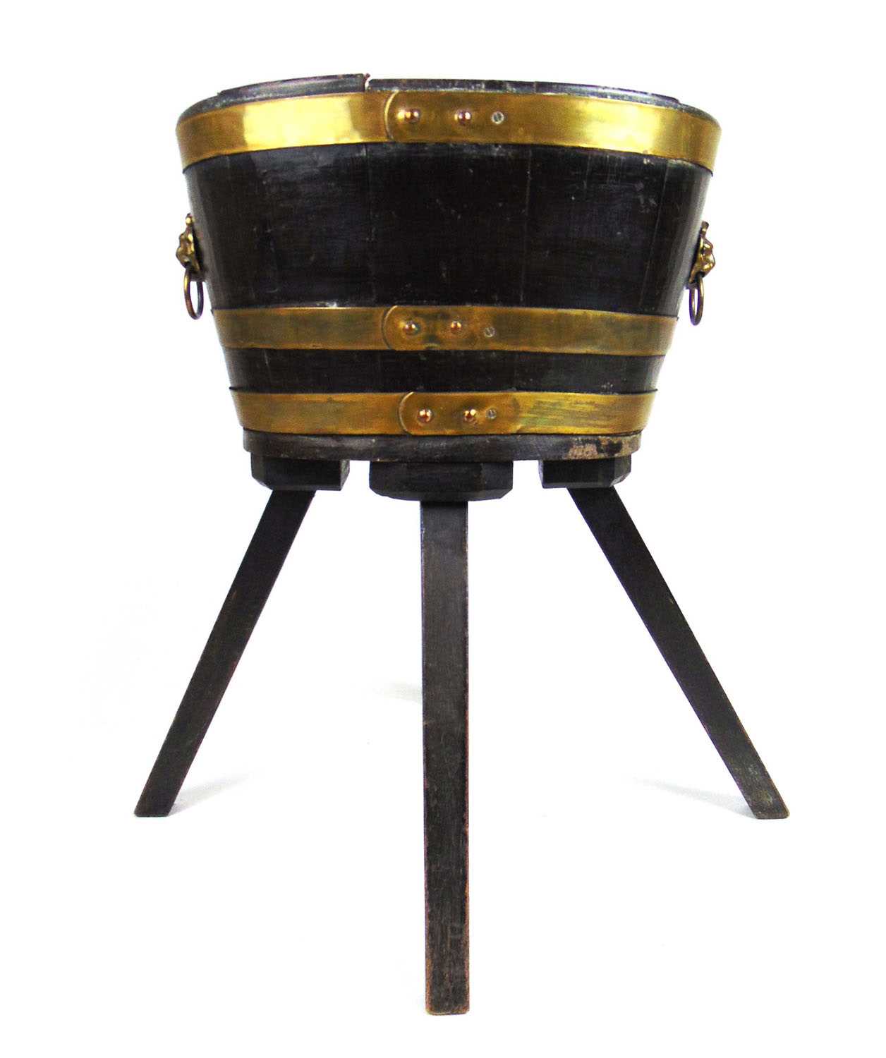 An 18th century oak and brass banded wine cooler on later base, the oval body with brass lion mask