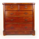 A late 19th/early 20th century mahogany chest of two short over three long drawers on bun feet, h.
