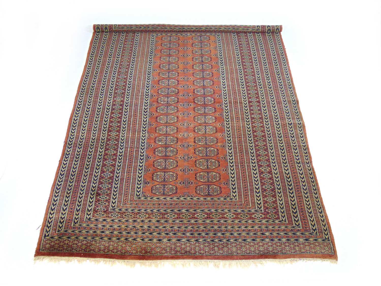 A handwoven Afghan rug, the multi line border surrounding the peach ground field with two columns of - Image 2 of 2