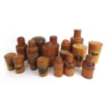 A collection of 19th/early 20th century treen bottle and glass holders to include Mauchline ware