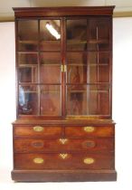An 18th century mahogany bookcase, the later cornice above two glazed doors enclosing adjustable