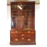 An 18th century mahogany bookcase, the later cornice above two glazed doors enclosing adjustable