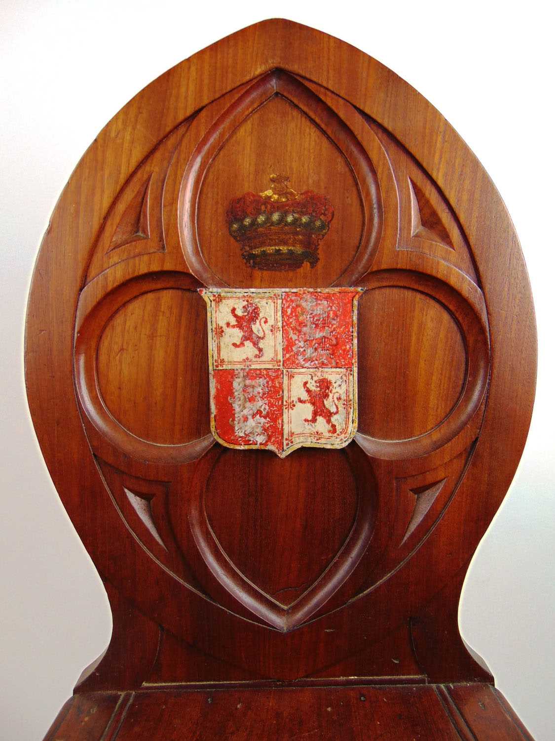 An early 19th century mahogany Gothic hall chair, the carved quatrefoil back with armorial shield - Image 2 of 4