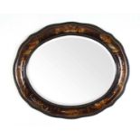 An early 20th century chinoiserie oval bevel glass mirror, h. 55 cm, w. 65 cmCondition