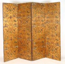 A 19th century embossed and polychrome leather four fold screen with gold ground floral and urn