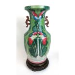 A large early 20th century Chinese porcelain baluster vase, the body decorated with a butterfly