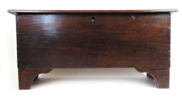 An early 18th oak six plank coffer, the moulded top lifting to reveal a vacant interior, h. 59 cm,