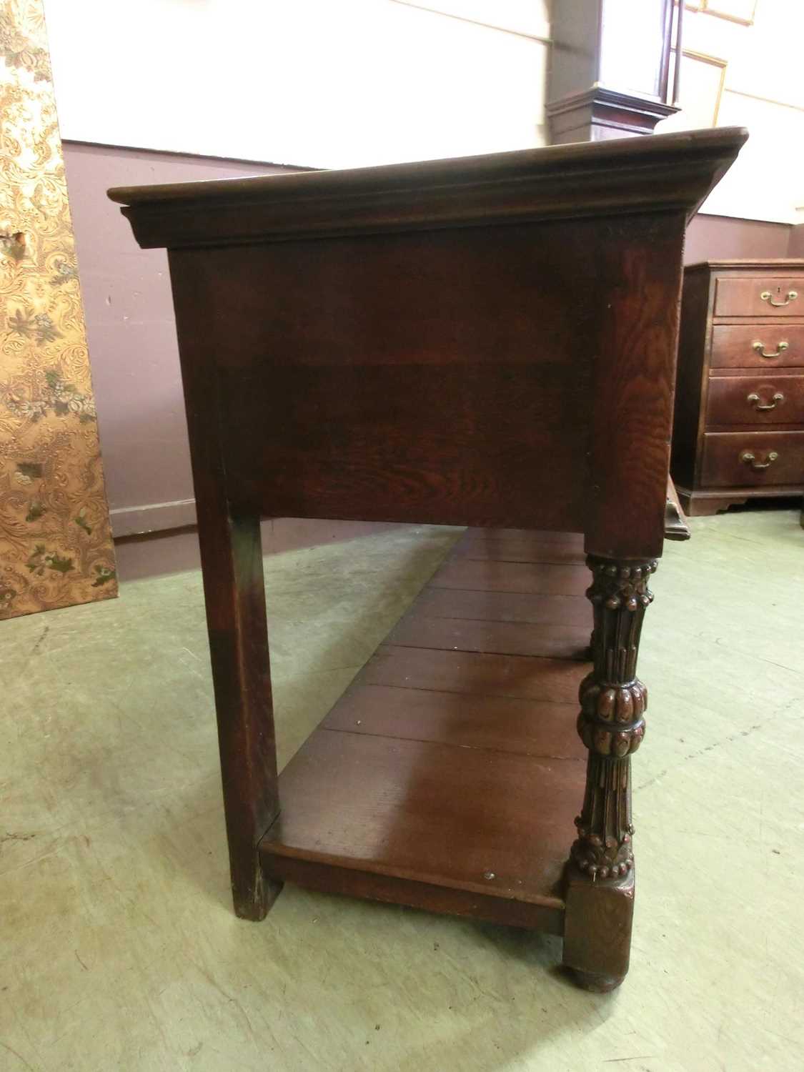 A 17th century style oak dresser base, the top over three panel front drawers over carved legs and - Image 7 of 12