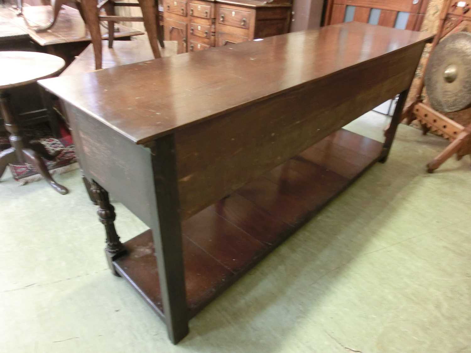 A 17th century style oak dresser base, the top over three panel front drawers over carved legs and - Image 10 of 12