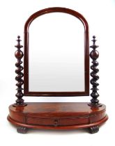 A Victorian mahogany toilet mirror, the arch top plate in moulded frame supported on barley twists