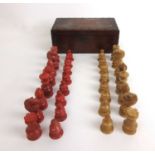 A 19th century stained Tagua nut chess set in wooden box, king h. 6 cm.