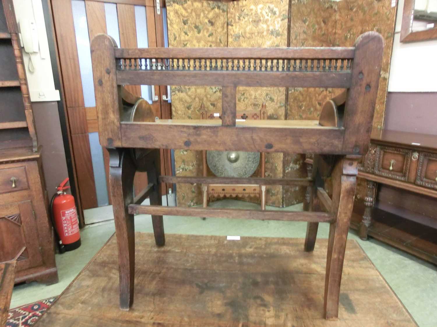 A late 19th century oak and brass mounted hall seat by James Shoolbred, Tottenham Court Road, - Image 10 of 10